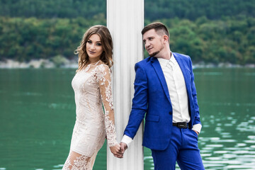 Fototapeta premium Beautiful young couple. Wedding. A family