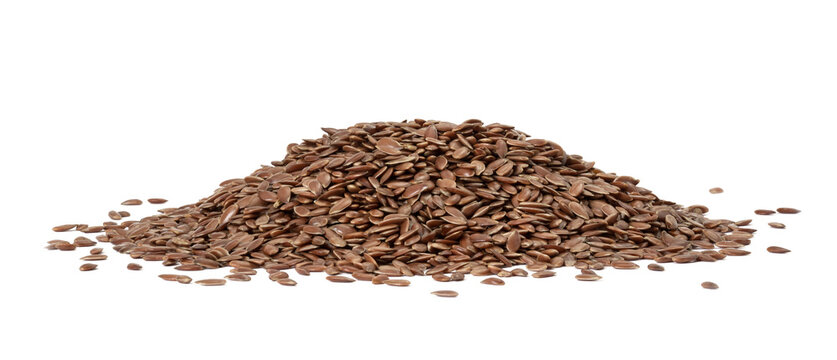 Large pile of linseed og flax seed seen from low angle and isolated on white background