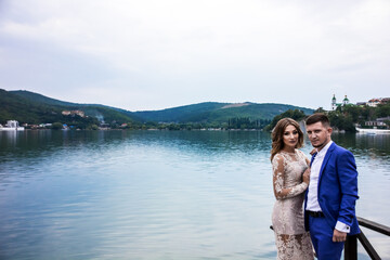Fototapeta premium Beautiful young couple. Wedding. A family