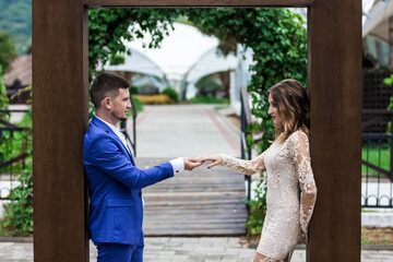 Fototapeta premium Beautiful young couple. Wedding. A family