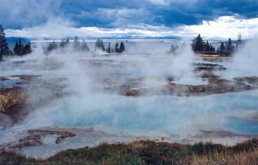Hot springs with steam in Yellowstone National Park, USA