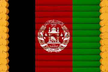 National flag  of Afghanistan on a wooden wall background. The concept of national pride and a...