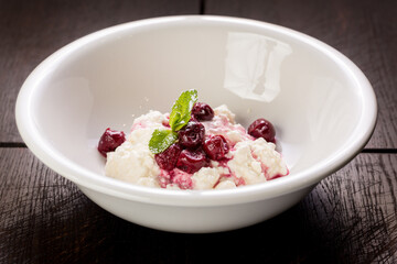 delicious cottage cheese dessert with cherry jam and mint