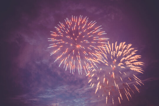 Beautiful fireworks for New Years, Independence Day or other holiday against the background of a dark sky