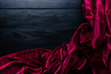table cloth on empty black wooden background, luxury red fabric velvet on black wooden table