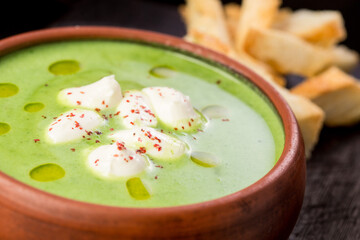 creamy broccoli soup with French baguette bread crumbs