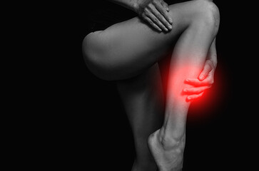 Obraz premium Woman pain legs. Shadow. Woman legs. Pain. 