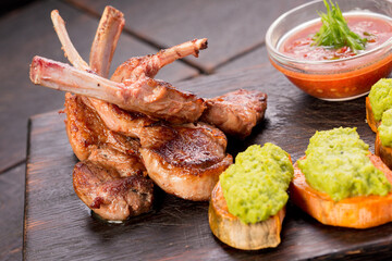 Rack of lamb with sweet potatoes, mint green peas puree and adjika
