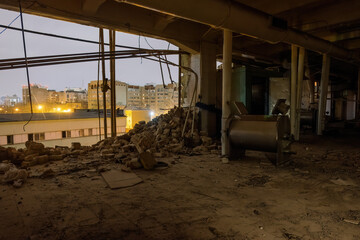 Ruined factory interior. Consequences of disaster, war or demolition