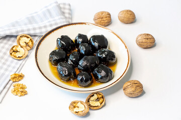 Handmade jam made from green fresh walnuts. Organic walnut jam and walnuts.