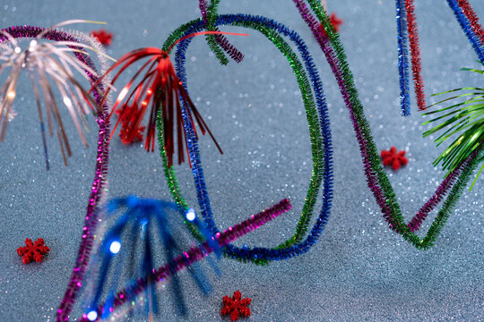 2021 New Years postcard with festive multicolored pipe cleaners.