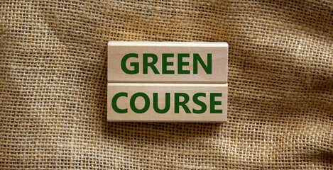 Green course symbol. Wooden blocks form the words 'green course' on beautiful canvas background. Business, ecological and green course concept. Copy space.