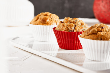 Homemade muffins with ginger and nuts on white table. Healthy eating, gluten free.Homemade tasty dessert or breakfast for Valentine's day,Mother's day