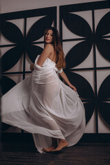 Fototapeta premium Beautiful pregnant girl in white dress