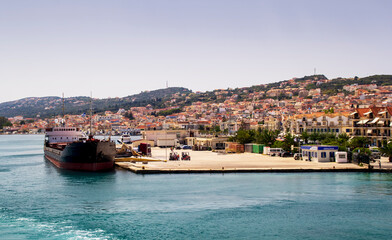 Ship docked in a greek port waiting to be loaded.