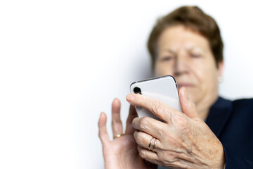 Senior woman texting on smartphone. Technology, communication and people concept.