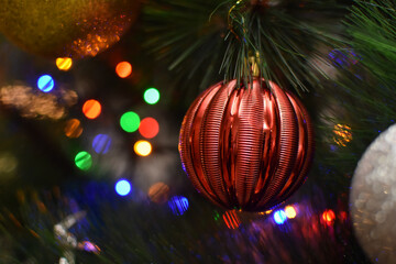 Christmas ornaments and light, selective focus. New Year's decorations on Christmas tree