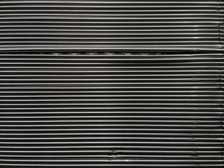 Obraz premium Full frame close-up side view of a segment of stacked large aluminum kitchen food containers