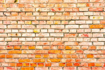 Obraz premium Texture of a brick wall with cracks and scratches which can be used as a background