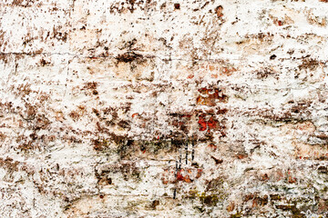 Texture of a brick wall with cracks and scratches which can be used as a background