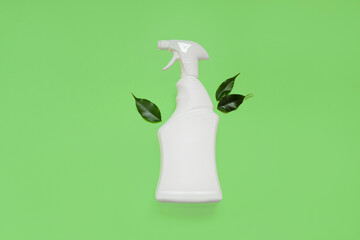 Biological and disinfecting general cleaning. Empty white bottle mockup for cleaning. Eco sprayer for safe harvesting green leaves on mint green and background.top view. copy space