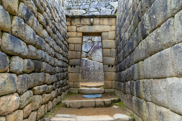 Peru, the Unesco world heritage ancient Inca site Machu Picchu. One of the doors.