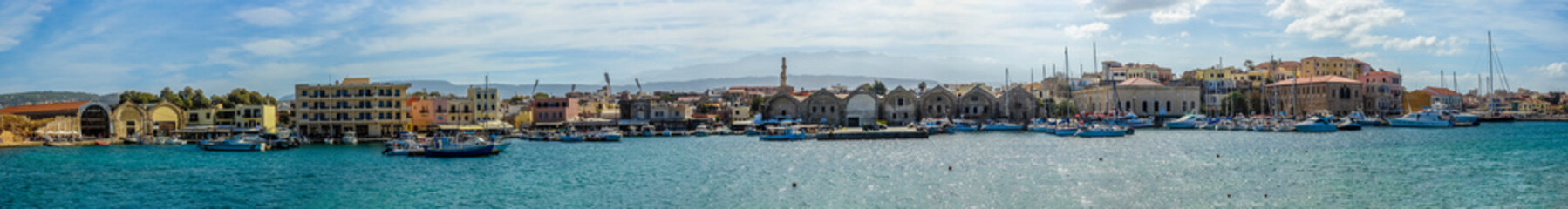 A wide panorama view of the inner harbour of Chania, Crete on a bright sunny day