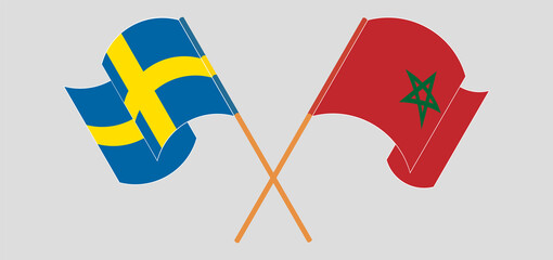 Crossed and waving flags of Sweden and Morocco