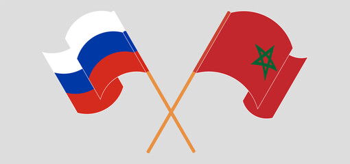 Crossed and waving flags of Russia and Morocco