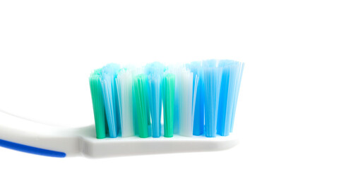 Toothbrush head close-up view, isolated on white background, macro