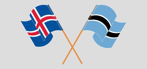 Crossed and waving flags of Iceland and Botswana