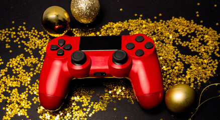 Joystick gaming controller with stars gold background. Holiday sale or black friday concept. Top view © Carlos.R.Ave