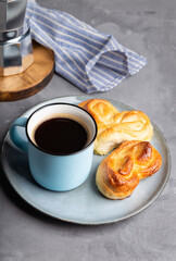 Cup of espresso coffee with sweet buns