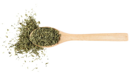 Chopped dry parsley leaves with wooden spoon, pile isolated on white background, top view