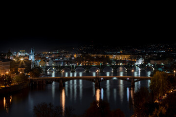 Fototapeta na wymiar .view of illuminated bridges on the Vltava river in the center of Prague at night