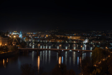 Fototapeta na wymiar .view of illuminated bridges on the Vltava river in the center of Prague at night