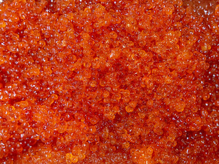 Obraz na płótnie Canvas Red caviar background. Salmon roe texture. Close up. 