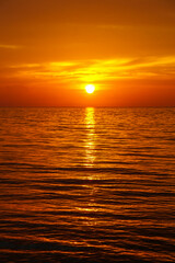 Intense orange key west sunset over waves