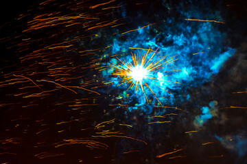 Fireworks Explosion display in the dark night sky.
