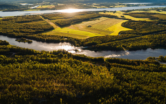 Bridge over river at sunset seen from the air, Finland