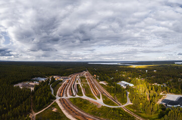 Hyrynsalmi railway yard with log wood waiting for railway transport to saw mills, Finland - 398959883