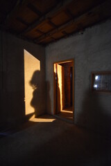 silhouette of woman in old house