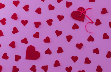 Valentines day background red hearts on pink background. Flat lay