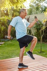 senior person exercising with dumbbells