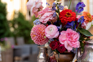 wedding decoration on the white table with fruits, flowers and antiques