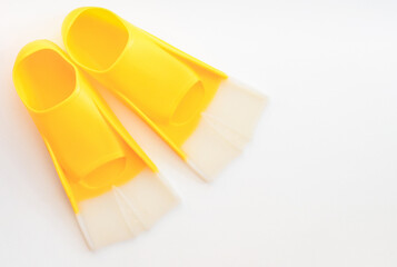 Flippers for swimming on a gray background. Yellow flippers,  for sports. illuminating yellow © Юлия Черкасова