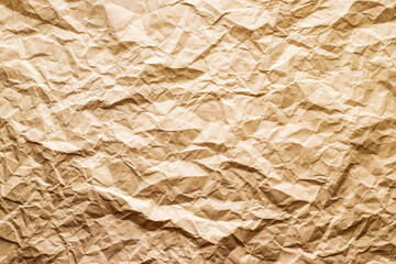Textured surface of wrinkled yellowish paper