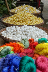 Baskets of silk and silk worms in Thailand