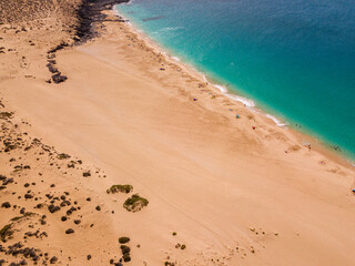 Aerial view of the beach Playa de Las Conchas in the north of La Graciosa, the main archipelago...