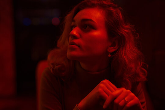 Portrait Of Young Pretty Woman Model In Red Light